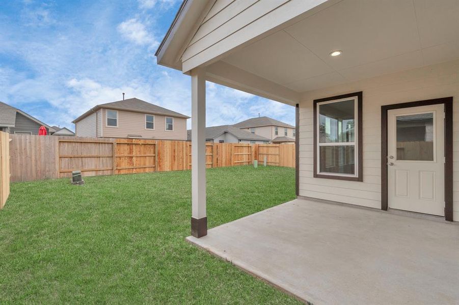 Experience outdoor living at its finest on this expansive covered patio. Sample photo of completed home with similar floor plan. As-built interior colors and selections may vary.