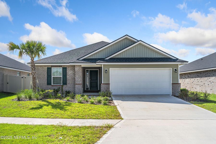 Front exterior of a new home in Shadow Crest at Rolling Hills, Green Cove Springs, FL, highlighting curb appeal (Image 20).