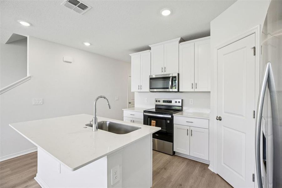 Furnished interior view inside a new home in The Reserve at Hammock Oaks Townes, Lady Lake (Image 13).