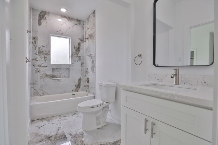 Conveniently shared guest bathroom connecting the two guest bedrooms. Conveniently shared guest bathroom connecting the two guest bedrooms.