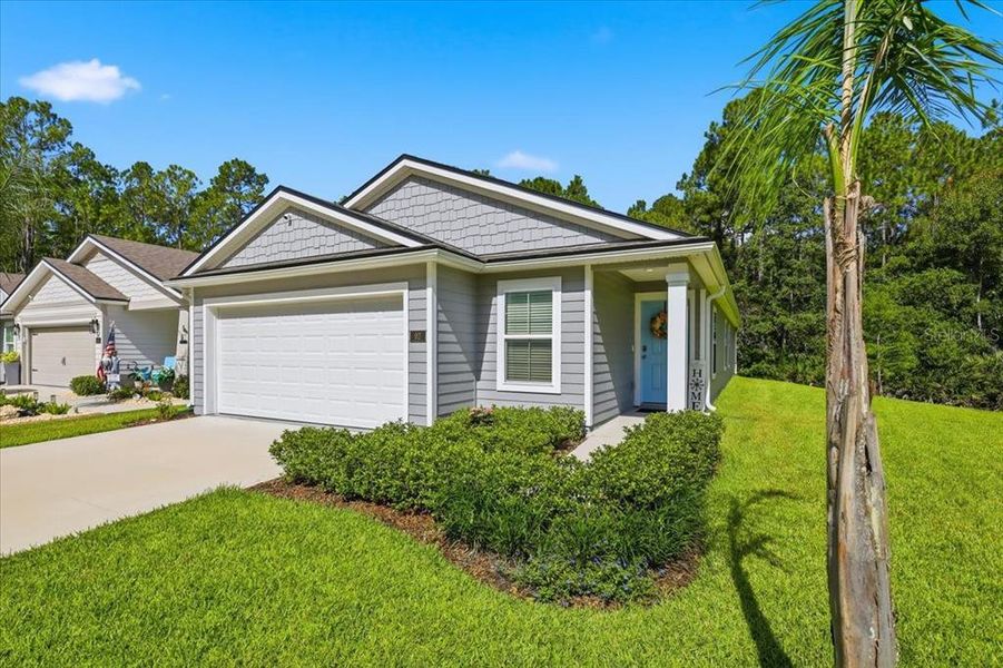 Front exterior of a new home in , Bunnell, FL, highlighting curb appeal (Image 2). Front exterior of a new home in , Bunnell, FL, highlighting curb appeal (Image 2).