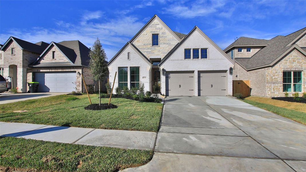 Front exterior of a new home in Escondido, Magnolia, TX, highlighting curb appeal (Image 2).