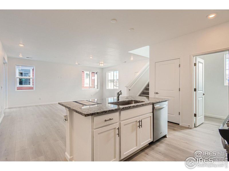 Kitchen flowing into your living room and big walk in pantry.