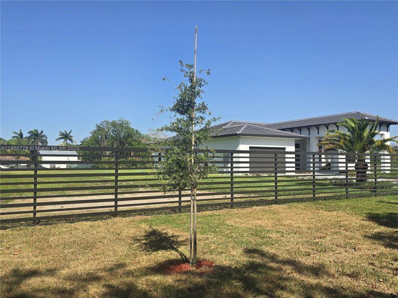 Front exterior of a new home in , Homestead, FL, highlighting curb appeal (Image 32).