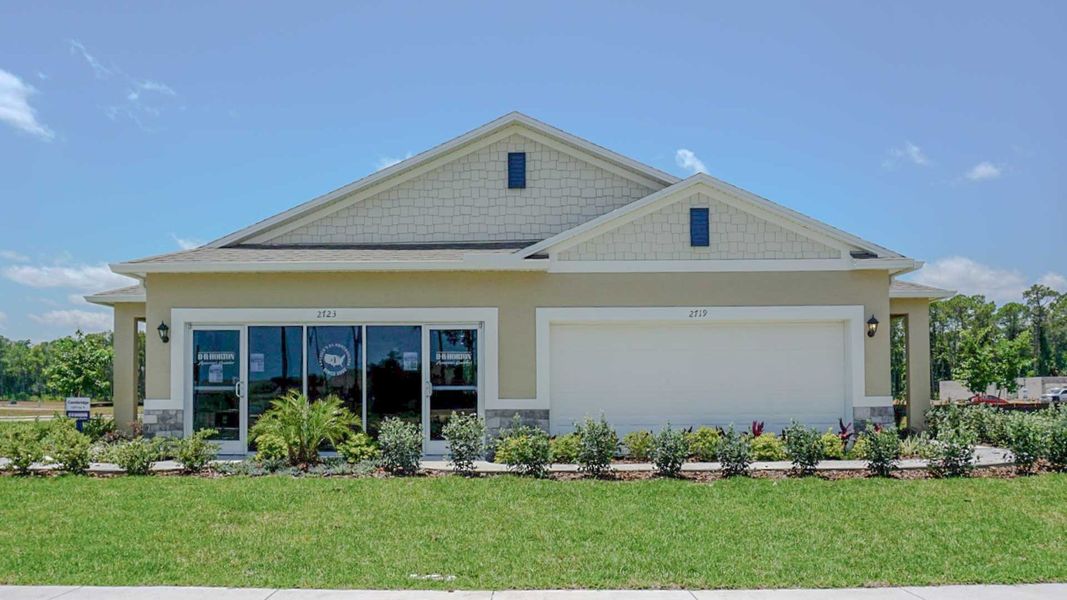 Front exterior of a new home in Halifax Plantation Villas, Ormond Beach, FL, highlighting curb appeal (Image 1). Front exterior of a new home in Halifax Plantation Villas, Ormond Beach, FL, highlighting curb appeal (Image 1).
