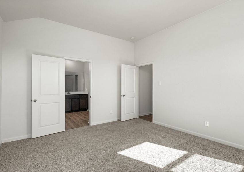 The master suite has a large bedroom, ensuite bathroom and a walk-in closet.