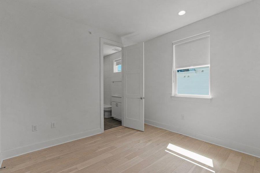 Crisp white walls and clean wood flooring define this versatile interior space. Crisp white walls and clean wood flooring define this versatile interior space.