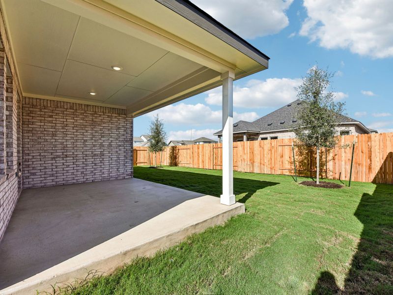 Exterior details and patio area of a home in Colony at Cole Springs - Boulevard Collection, Buda (Image 2). Exterior details and patio area of a home in Colony at Cole Springs - Boulevard Collection, Buda (Image 2).