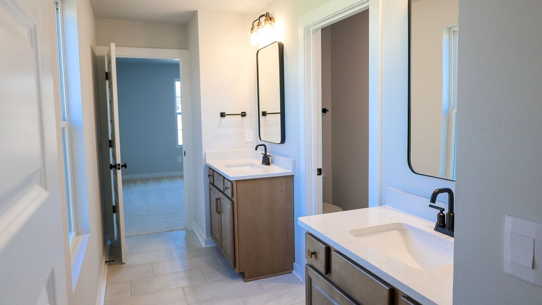 Representative furnished interior of a home built from the STONEBROOK II by D.R. Horton in Harvest Point, Spring Hill (Image 19).