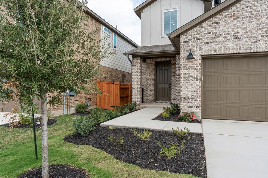 Exterior details and patio area of a home in Lariat, Liberty Hill (Image 27).