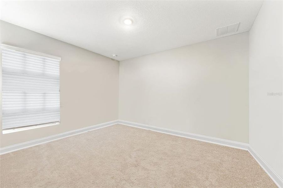 Spacious, unfurnished interior of a new home in Sawmill Branch, Palm Coast (Image 18).