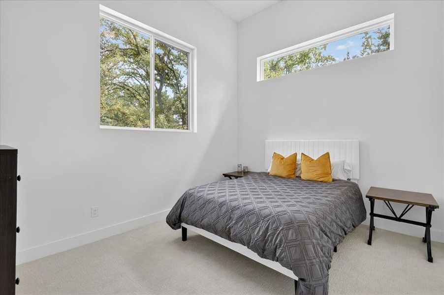 Spacious guest room filled with natural light