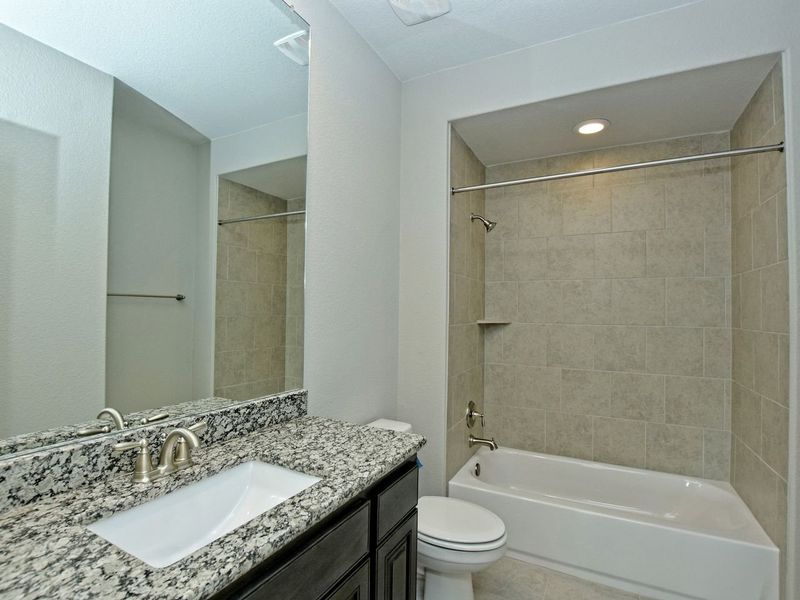 Representative furnished interior of a home built from the Madera II by Giddens Homes in Scofield Farms Estates, Georgetown (Image 204).