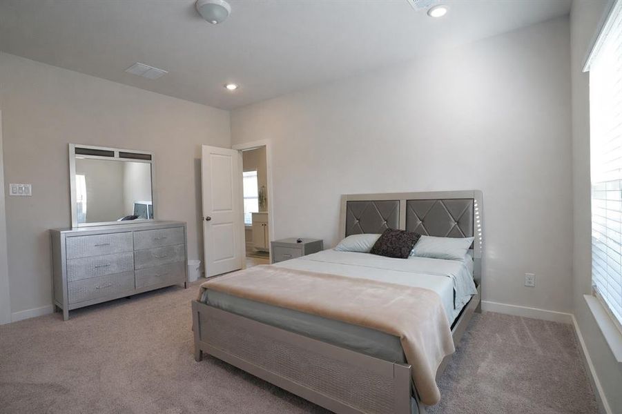 Carpeted room featuring recessed lighting, a window with blinds, and light neutral wall paint
