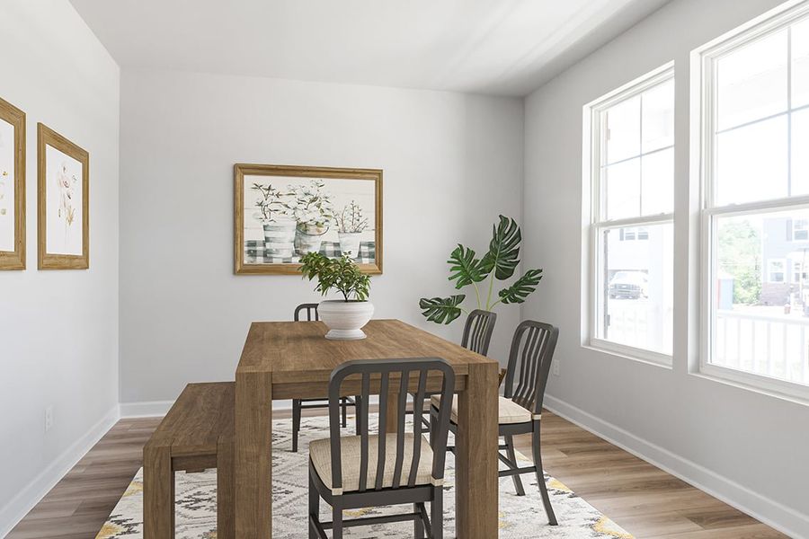 A dining room table with chairs and a plant on it. A dining room table with chairs and a plant on it.