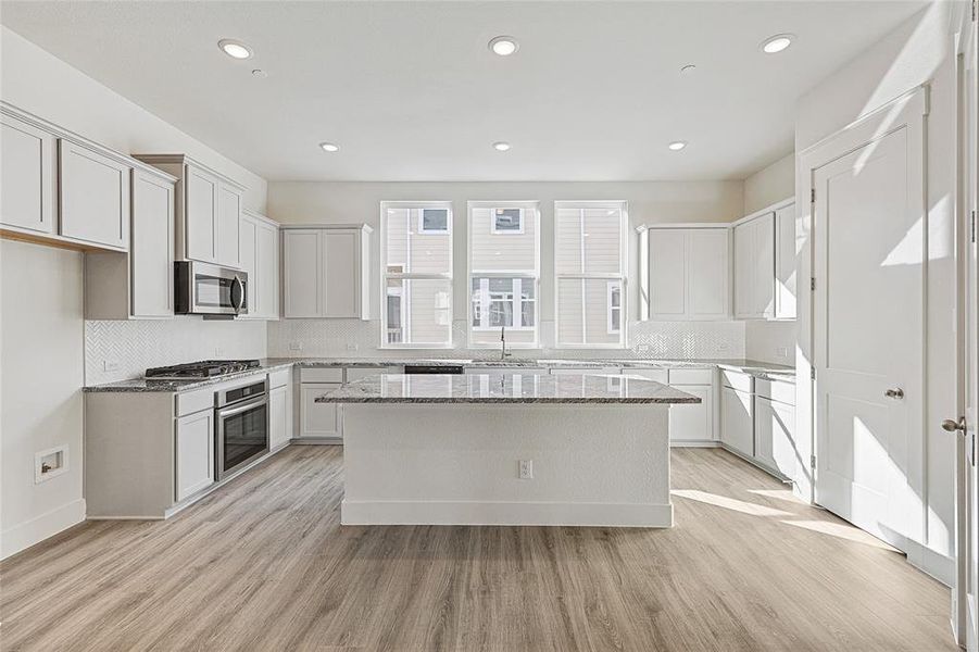 Furnished interior view inside a new home in Collin Creek, Plano (Image 4).