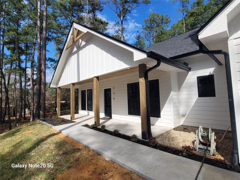 Front exterior of a new home in , Brookeland, TX, highlighting curb appeal (Image 1).