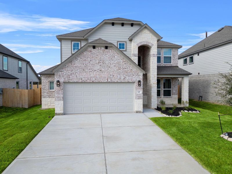 Front exterior of a new home in Beacon Hill, Waller, TX, highlighting curb appeal (Image 2). Front exterior of a new home in Beacon Hill, Waller, TX, highlighting curb appeal (Image 2).