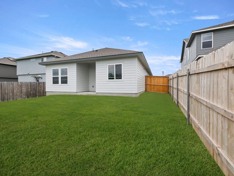 A private yard with new fencing offers ample space for outdoor enjoyment.