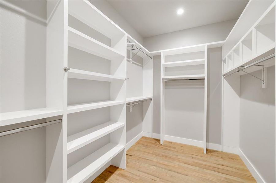 Walk in closet featuring hardwood / wood-style flooring