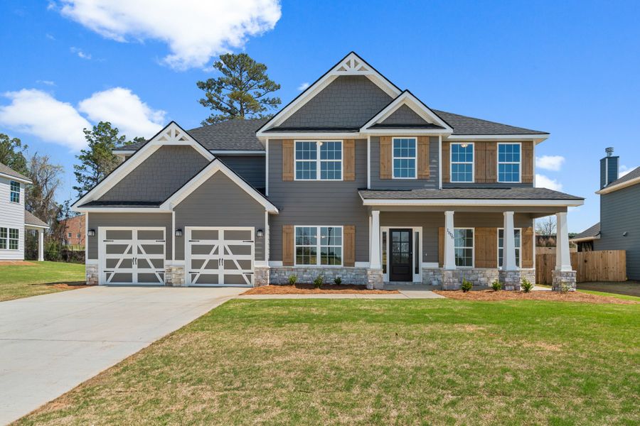 Representative exterior photo of a completed home built from the Jackson by Hughston Homes in Juliette Crossing, Forsyth, GA (Image 30).