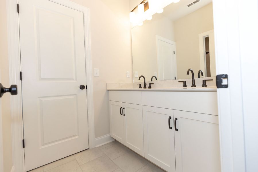 Representative furnished interior of a home built from the The Tensley by The Providence Group in Waterhaven, Cumming (Image 16).