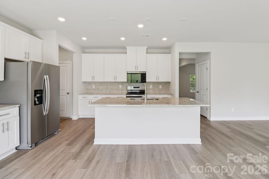 Photo is not of the actual home, but is an inspirational photo of builder’s model home and may depict options, furnishings, and/or decorator features that are not included