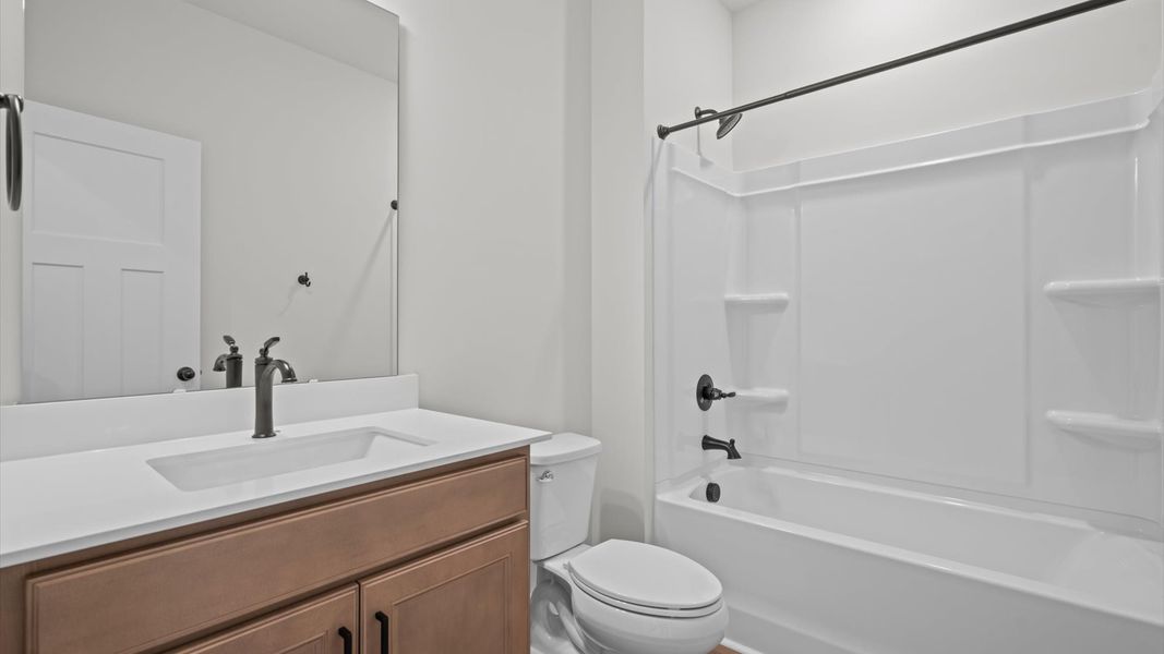 Superior bath with clean lines, contemporary lighting, and timeless style