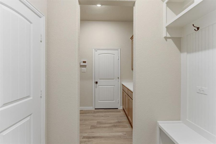 Mudroom featuring light wood-style flooring