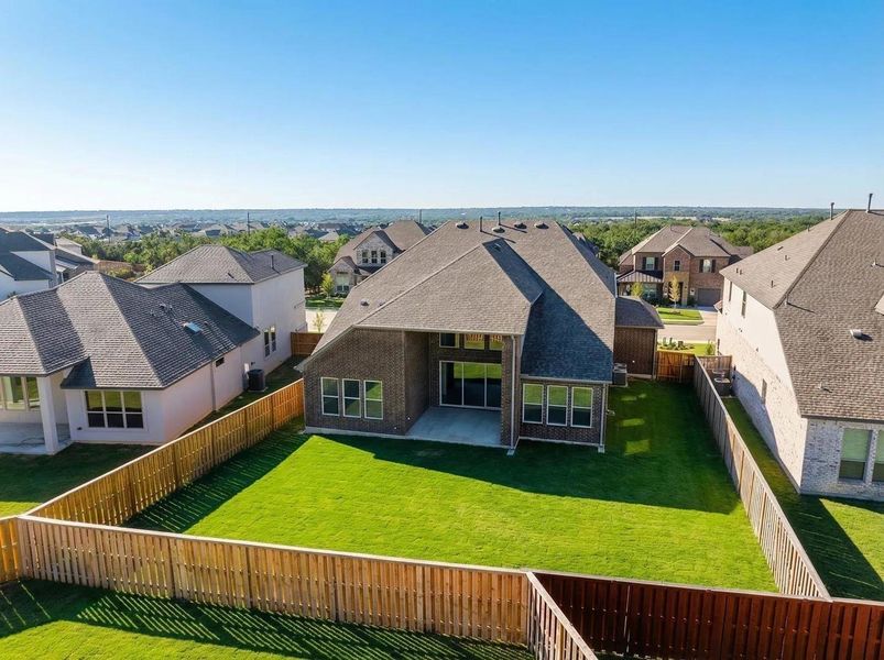 Exterior details and patio area of a home in Parmer Ranch 60, Georgetown (Image 3).