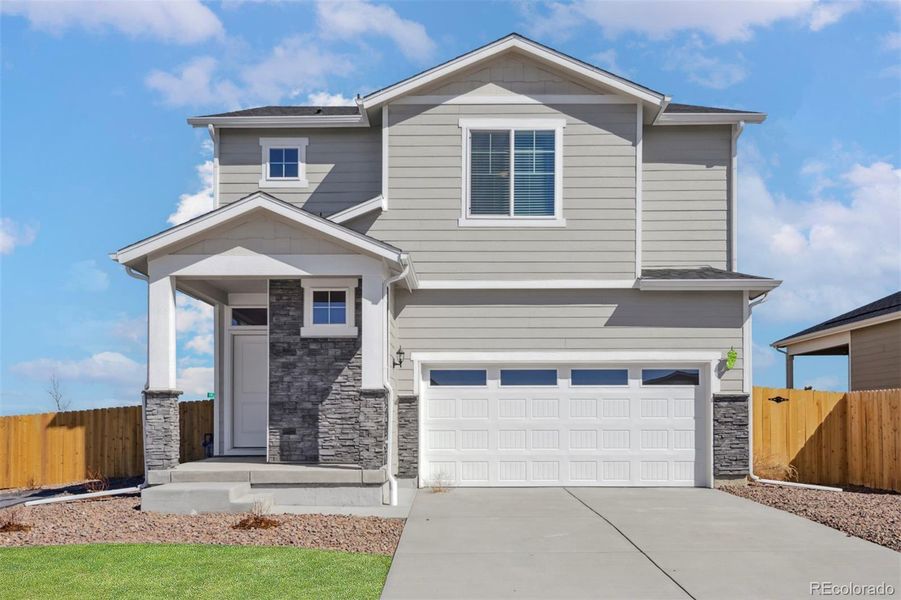 Front exterior of a new home in Second Creek Farm, Commerce City, CO, highlighting curb appeal (Image 2).