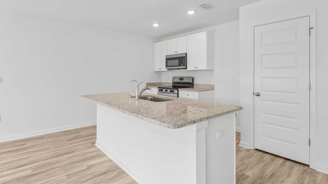 Furnished interior view inside a new home in Magnolia at the Bluffs Phase 3, Freeport (Image 3).