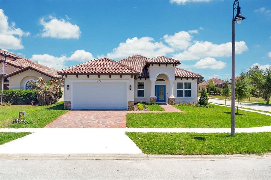 Front exterior of a new home in , Haines City, FL, highlighting curb appeal (Image 25).
