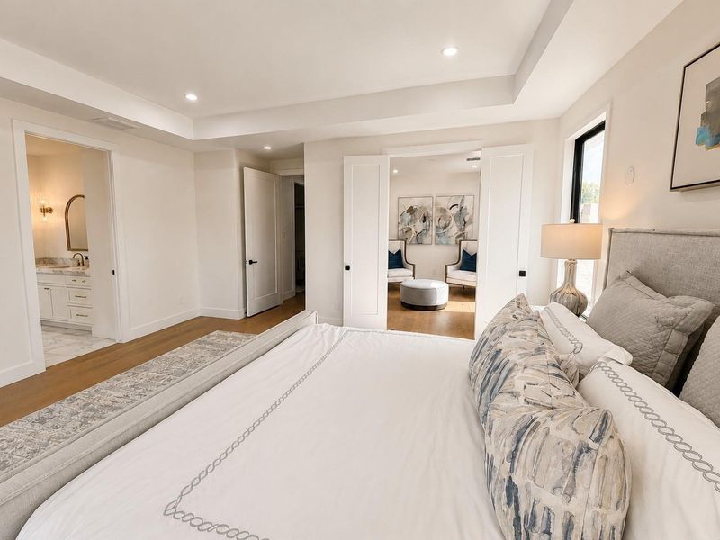 Oversized master bedroom with views into master sitting area