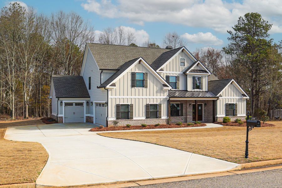 Front exterior of a new home in Stonegate, Monroe, GA, highlighting curb appeal (Image 2). Front exterior of a new home in Stonegate, Monroe, GA, highlighting curb appeal (Image 2).