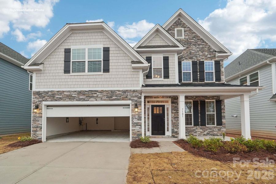 Front exterior of a new home in Oak Grove Hill, Huntersville, NC, highlighting curb appeal (Image 1). Front exterior of a new home in Oak Grove Hill, Huntersville, NC, highlighting curb appeal (Image 1).