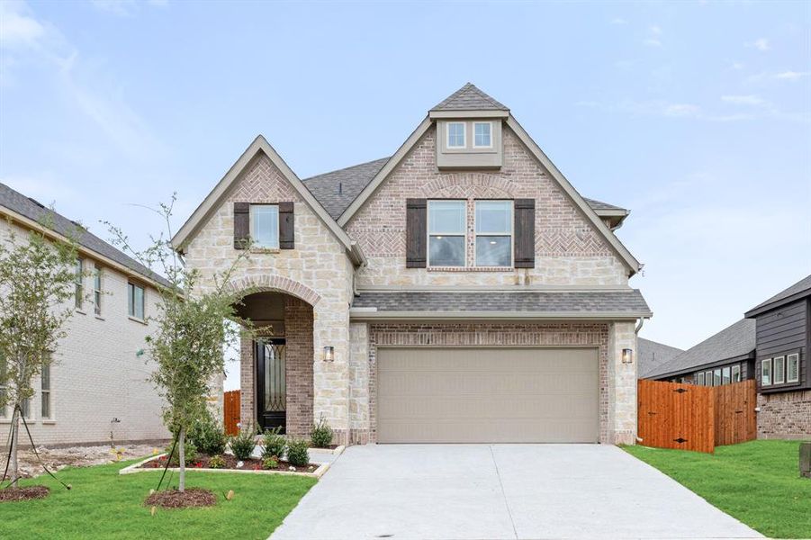 Front exterior of a new home in Star Ranch, Godley, TX, highlighting curb appeal (Image 2).