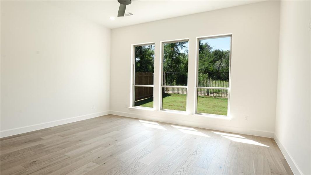 Full bathroom with a freestanding bath, marble look tiles, and vanity Full bathroom with a freestanding bath, marble look tiles, and vanity
