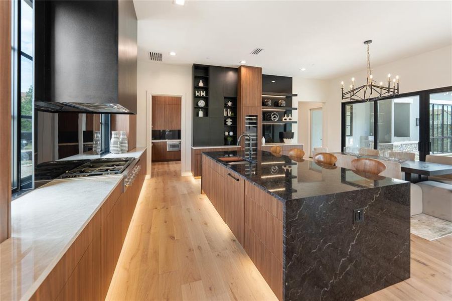 Spacious Kitchen Island with Waterfall Edge and Wind Fridge