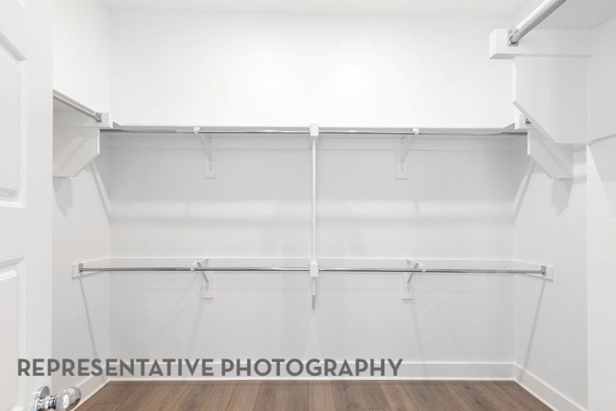 Spacious closet featuring wood finished floors Spacious closet featuring wood finished floors