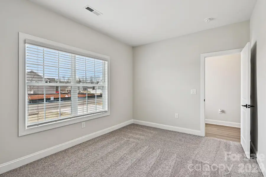 Spacious, unfurnished interior of a new home in Colonial Crossing, Troutman (Image 12).