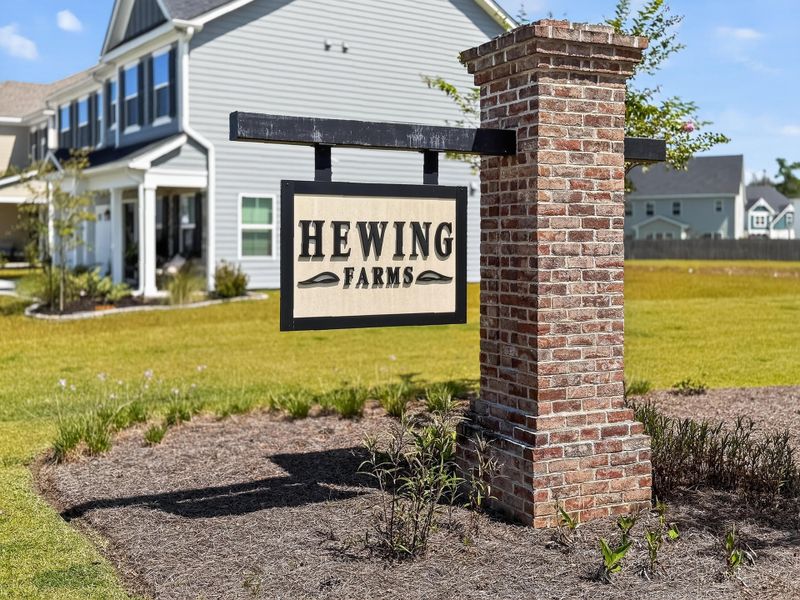 Front exterior of a new home in Hewing Farms, Summerville, SC, highlighting curb appeal (Image 1).