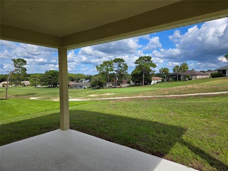 covered lanai with golf course view covered lanai with golf course view