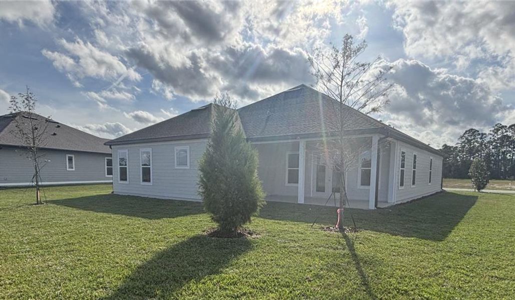Exterior details and patio area of a home in Ardisia Park Estate, New Smyrna Beach (Image 23).