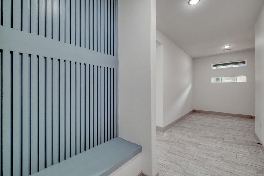 Are right in front of Garage entrance with built in bench and decorative wall Are right in front of Garage entrance with built in bench and decorative wall