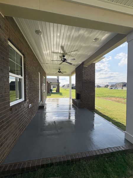 Jumbo Covered porch with 2 ceiling fans and bricked wood burning fireplace. Jumbo Covered porch with 2 ceiling fans and bricked wood burning fireplace.
