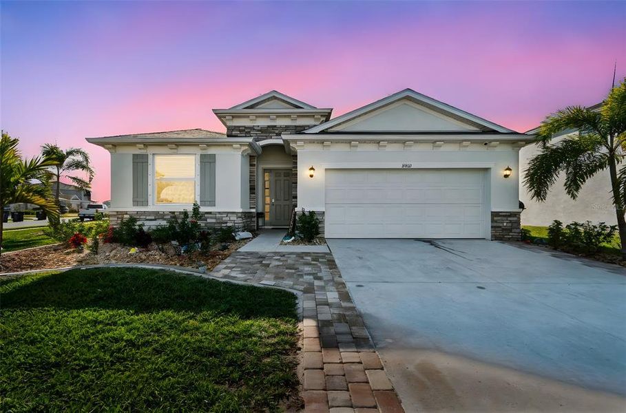 Front exterior of a new home in Bella Lago, Parrish, FL, highlighting curb appeal (Image 23).