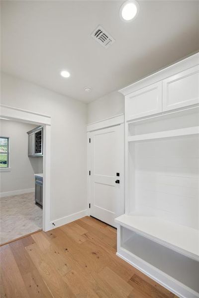 Mudroom with light wood-type flooring