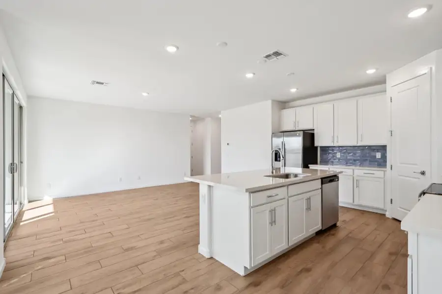Kitchen and great room. Representative images and renderings are for illustrative purposes. Actual structural options and design finishes of home may vary.