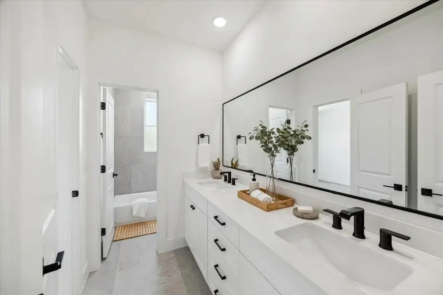 A stunning contrast of clean lines and intricate tile designs gives this bathroom a refined elegance. A stunning contrast of clean lines and intricate tile designs gives this bathroom a refined elegance.